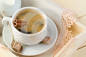 Fresh coffee with cinnamon and sugar