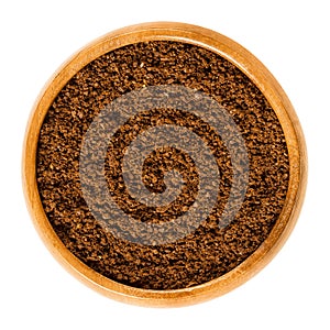 Fresh coffee powder in wooden bowl