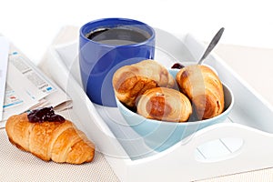 Fresh coffee and tasty croissant