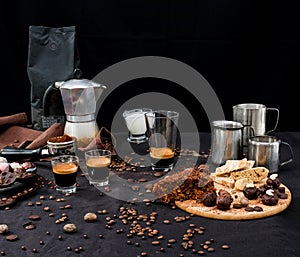Fresh coffee, truffles and a piace of a chocolate cake photo