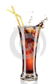 Fresh cola juice and ice cubes splash