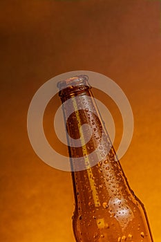 Fresh cold beer ale bottle with drops without stopper beer cap