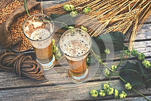 Fresh cold beer glasses in rustic setting