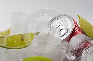 Fresh and cold drink.Pieces of lime and canned water.Summer refreshing beverage