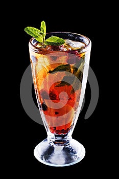 Fresh cold strawberry tea with ice and mint on black isolated background