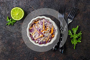 Fresh coleslaw salad made of shredded red and white cabbage and carrots