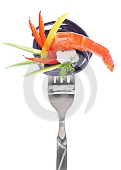 Fresh colorful composition seafood with pasta on fork