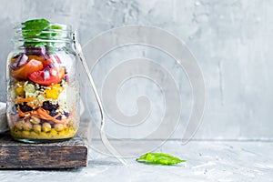 Fresh colorful salad in the jar
