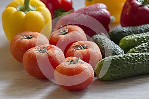 Fresh and colorful vegetables lie on the kitchen table