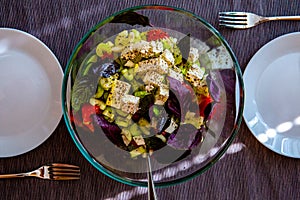 Fresh colorful yellow green cauliflower broccoli salad with goat cheese
