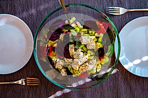Fresh colorful yellow green cauliflower broccoli salad with goat cheese