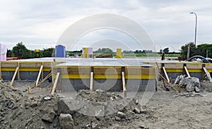 Fresh concreted base plate photo
