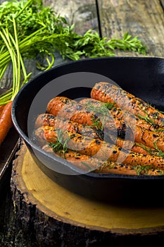 Fresh cooked carrots in a cast iron skillet