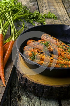 Fresh cooked carrots in a cast iron skillet