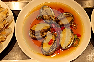 Fresh cooked korean sea snails in the plate