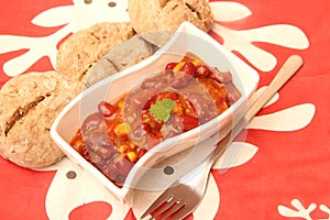 A stew of red beans, meat and corn