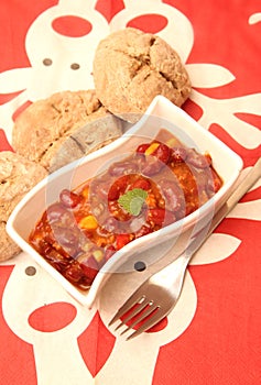 A stew of red beans, meat and corn