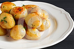 Fresh Cooked, new potatoes,with dill, on a wooden table, selective focus. close-up, toning, no people,