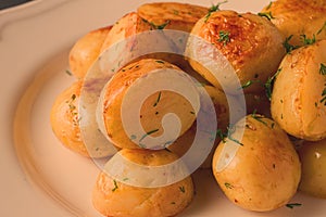 Fresh Cooked, new potatoes,with dill, on a wooden table, selective focus. close-up, toning, no people,