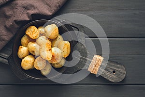 Fresh Cooked, new potatoes,with dill, on a wooden table, selective focus. close-up, toning, no people,