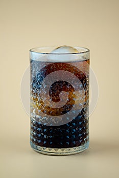 Fresh cool glass of soft drink with ice