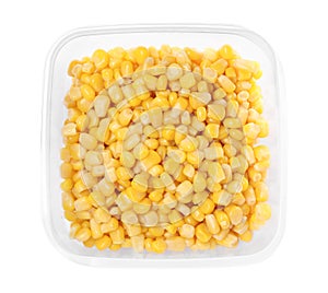 Fresh corn kernels in plastic container isolated on white, top view