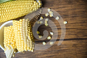 Fresh corn on sack and sweet corn seed rustic wooden table background