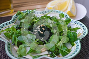 Salad with spirulina. Healthy food concept photo
