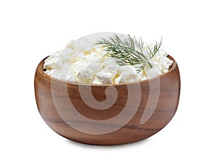 Fresh cottage cheese with dill in wooden bowl isolated on white
