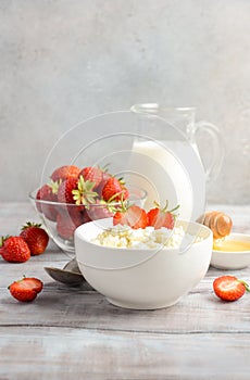 Fresh cottage cheese with fresh strawberries, healthy breakfast concept