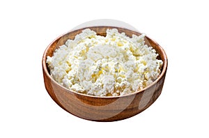 Fresh Cottage cheese in a wooden bowl. Isolated on white background. Top view.