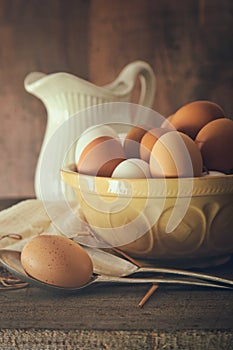 Fresh country eggs in bowl on table