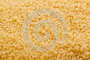 Fresh couscous on a white acrylic background