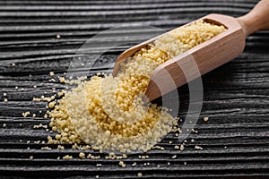 Fresh couscous on a wooden rustic background
