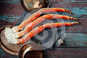 Fresh crab claws on vintage wooden background