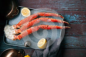 Fresh crab claws on vintage wooden background