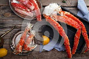 Fresh crab claws on vintage wooden background