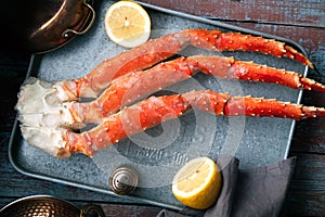 Fresh crab claws on vintage wooden background