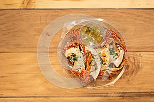 Fresh crab meat on wooden table