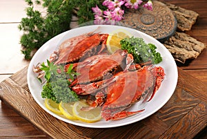 Fresh crab seafood plate with shellfish shrimps and lemon herb, Seafood fresh crab boil or steam for cook food with on table