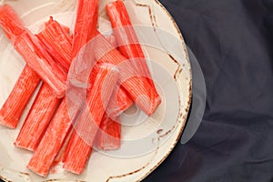 Fresh crab stick on clean plate.