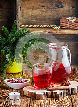 Fresh cranberry juice. The compote. Hot Christmas drink from the berries with cinnamon and star anise