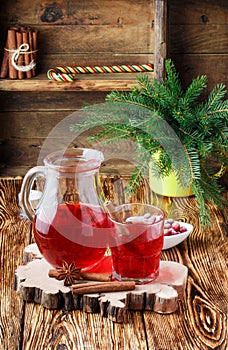 Fresh cranberry juice. The compote. Hot Christmas drink from the berries with cinnamon and star anise