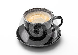 Fresh creamy black coffee in black cup with saucer on white background