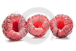 Fresh crimson raspberry isolated on white