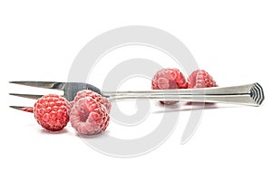 Fresh crimson raspberry isolated on white