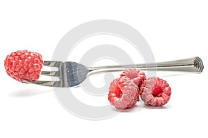 Fresh crimson raspberry isolated on white