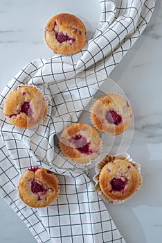Sweet vanilla raspberry muffins on a table