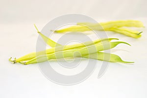 Yellow beans on a white background.