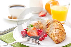 Fresh croissant with berries
